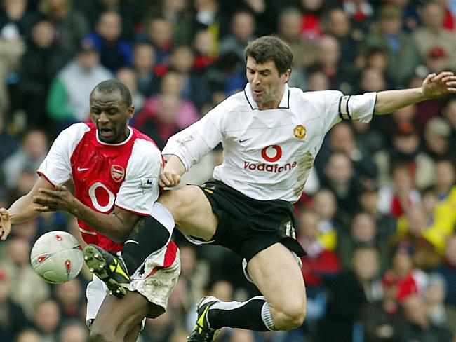 Former Manchester United captain Roy Keane vies for the ball against Patrick Vieira in 2004.