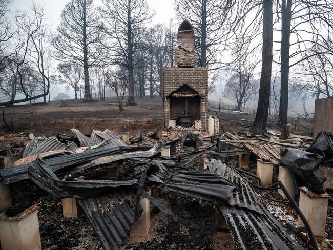 The burnt-out remains of the home Gary Henderson and Sara Tilling, which they lost in the bushfire that swept through Cobargo and surrounding areas on New Years Eve 2019. Cobargo, Thursday, January 16, 2020. Henderson and Tilling ran the Cobargo Wildlife Sanctuary from their home which they lost, and lost all their animals, and have only been able to rescue one Kangaroo since the fires. Bushfires swept through Cobargo on New Years Eve 2019 destroying several homes and businesses. (AAP Image/James Gourley) NO ARCHIVING