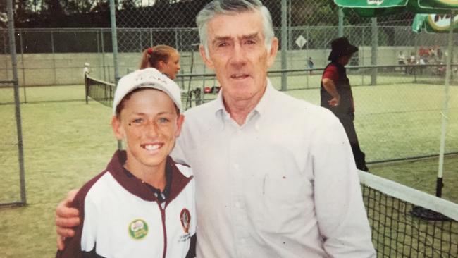 John Millman aged 11 with champion tennis player Ken Rosewall.