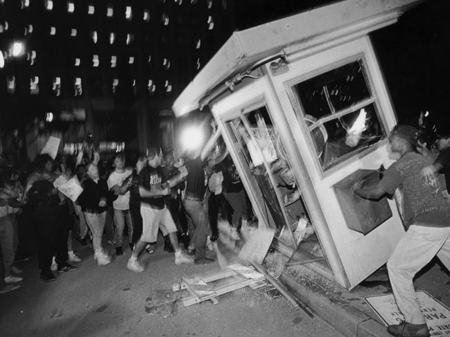 Rioters in downtown Los Angeles during the 1992 riots that swept the city for days. Picture: Getty