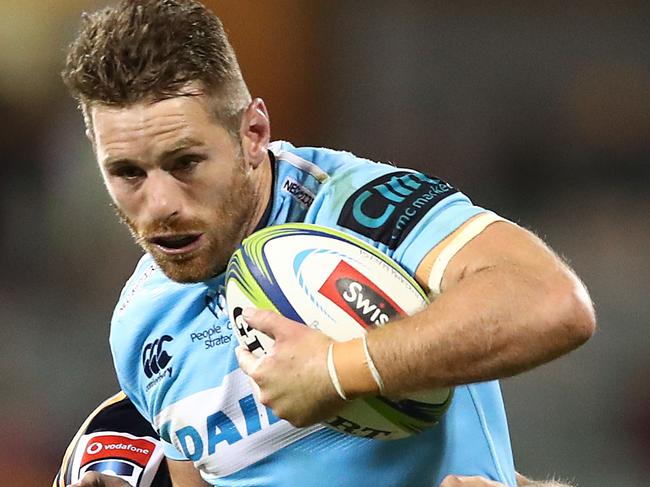 CANBERRA, AUSTRALIA - MARCH 15: Bernard Foley of the Waratahs Is tackled during the round five Super Rugby match between the Brumbies and the Waratahs at GIO Stadium on March 15, 2019 in Canberra, Australia. (Photo by Mark Metcalfe/Getty Images)