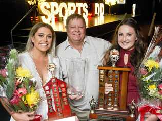 SPORT STARS: Coach Graham Pitt (centre) congratulates his athletes Ellie Bowyer (left) and Lara Nielsen on their award wins last year. Picture: Nev Madsen