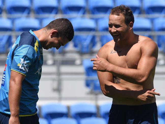 Titans train at Cbus Super Stadium. Pictured is Ash Taylor and Tyrone Roberts.  Photo: Steve Holland