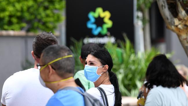 People queue outside the Centrelink office in Southport, on the Gold Coast, in March 2020. Picture: AAP