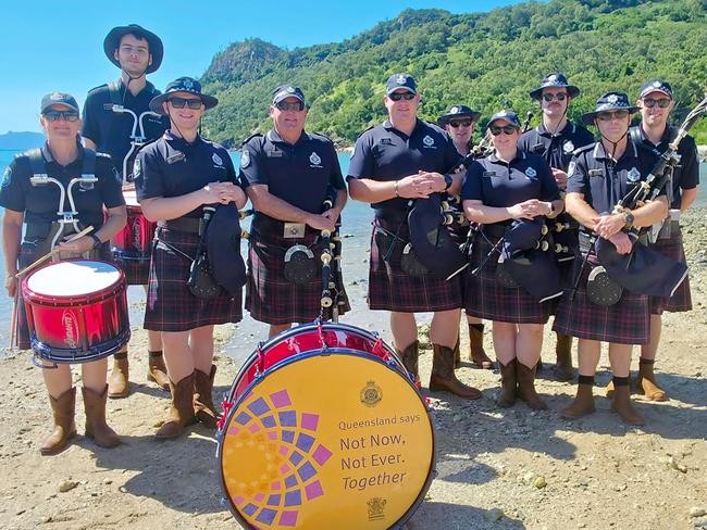 The QPS Pipes and Drums made a surprise stop on South Molle Island. Photo: Contributed