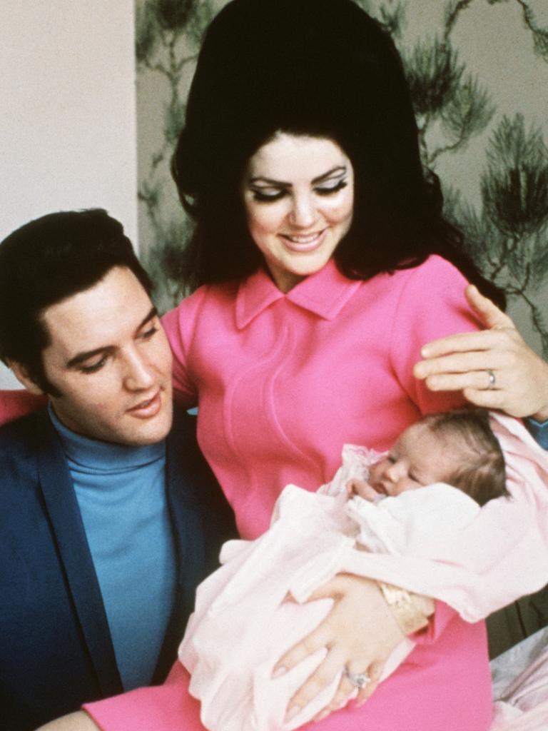 Elvis Presley and Priscilla with Lisa Marie in 1968.