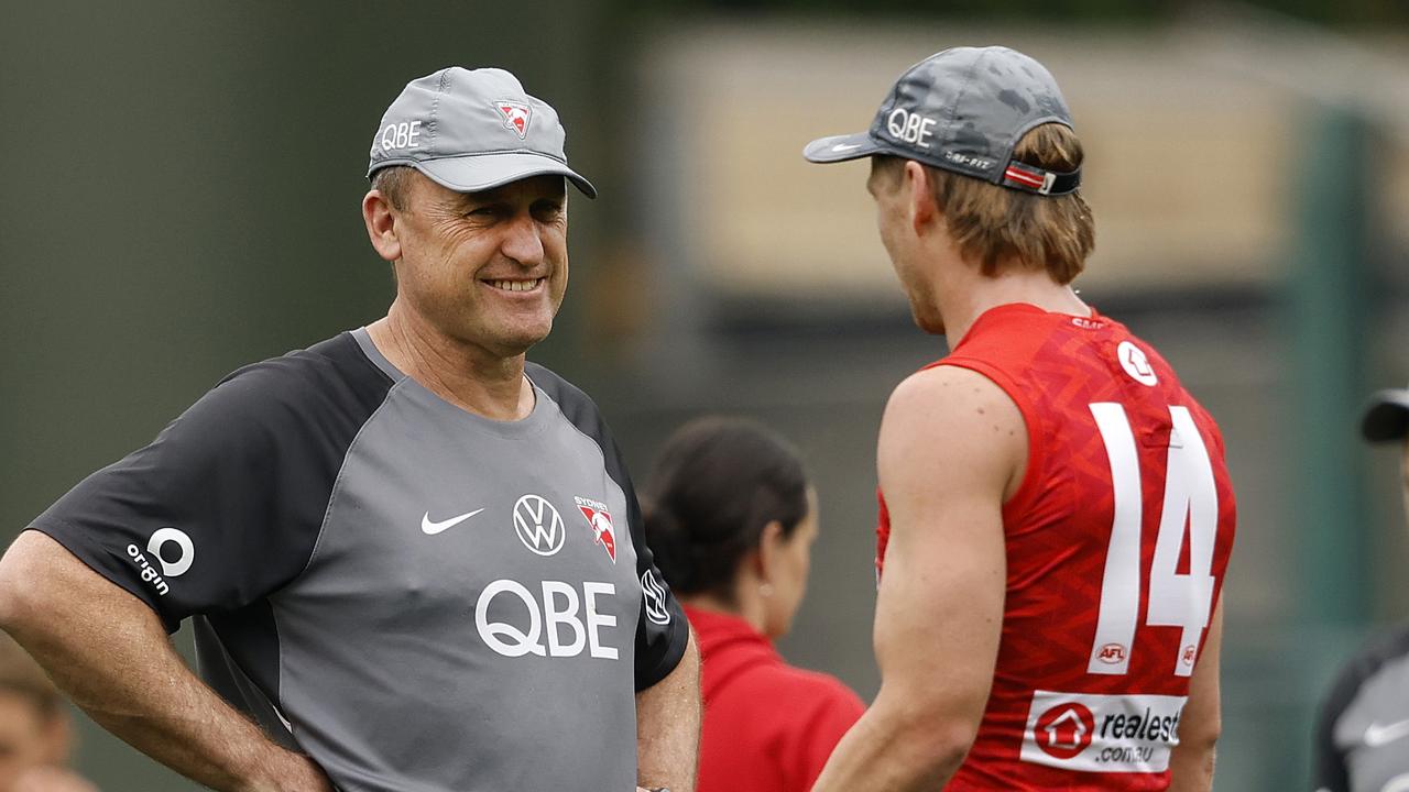 Callum Mills (right) spoke to Sydney coach John Longmire at the end of the Swans’ training session on Wednesday before Mills was ruled out of the grand final. Picture: Phil Hillyard