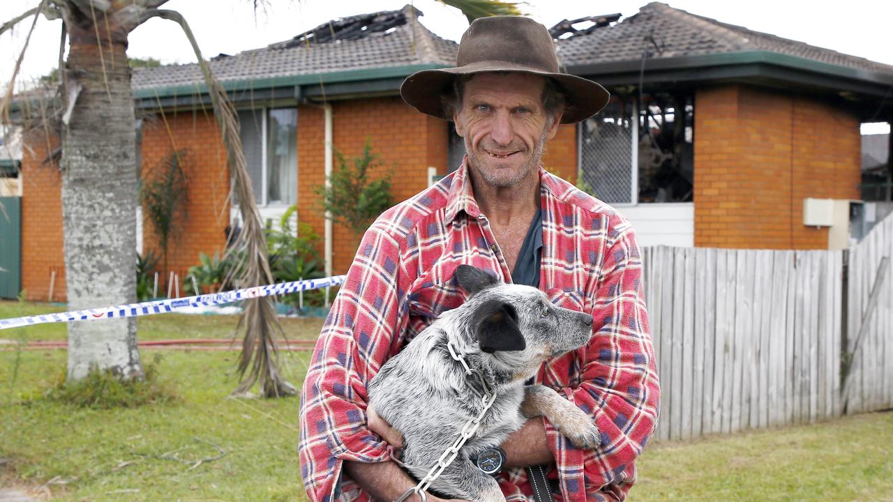 Shane Constable with his dog Ghidea lives in the house that caught fire on Thompson street in Deception Bay. Picture: Tertius Pickard