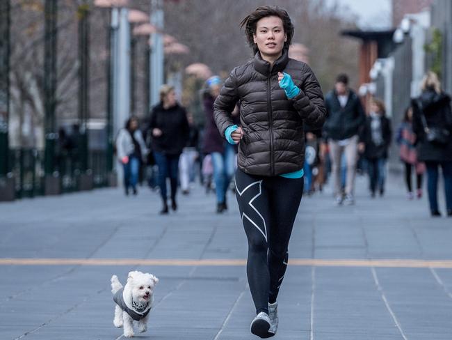 Jeez Tng takes dog Nerdy for a run. Pictures: Jake Nowakowski