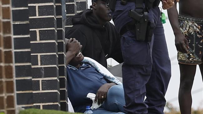 Shocked family members at the scene on Tuesday. Picture: Richard Dobson.