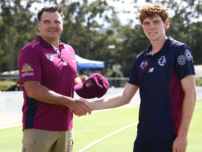 Joe Dawes presents recent Queensland debutant Callum Vidler his cap before the Sheffield Shield match against New South Wales, in March. Picture: Chris Hyde/Getty Images