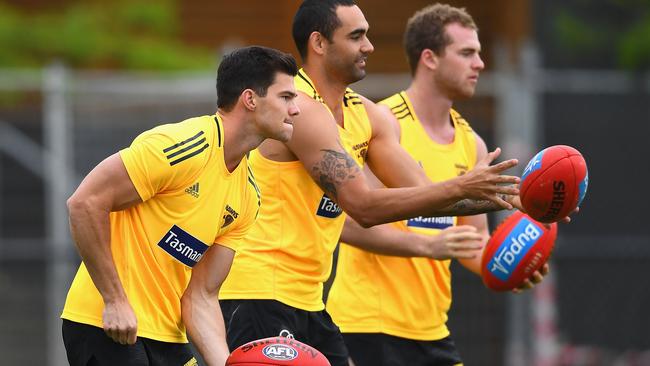 (From left) Jaeger O'Meara, Shaun Burgoyne and Tom Mitchell at Hawthorn training.