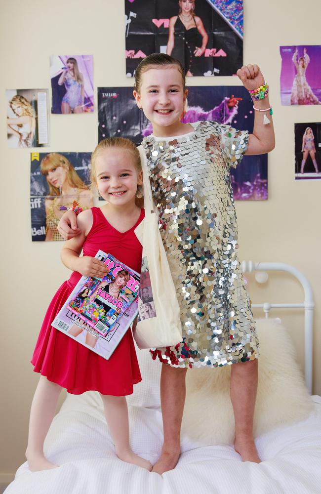 Charlotte, 5, with her sister Zara Bryan-Mathieson, 9, celebrate her Taylor Swift tickets, at home in Turramurra, today. Thanks to Starlight, she will attend Taylor Swift's show in Sydney on Saturday night. Picture: Justin Lloyd/The Daily Telegraph.