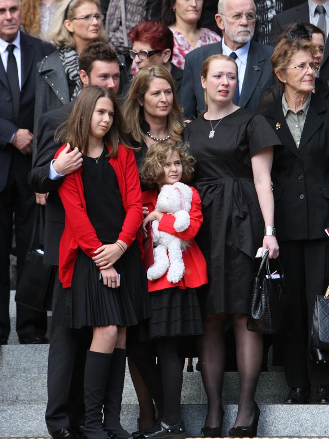 The funeral of Ken Talbot at St. Johns Cathedral in Brisabne. Wife Amanda with son Liam, oldest daughter Courtney, daughters Alex, 11 and Claudia, 8. Picture: Rob Maccoll