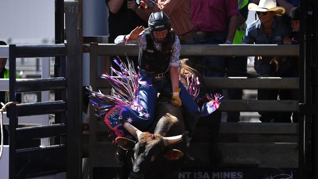 Sharlette Johnson, 16, the only female to compete in the junior bullride event, in action at the Mount Isa Mines Rodeo on Friday. Picture: Dan Peled/Getty Images