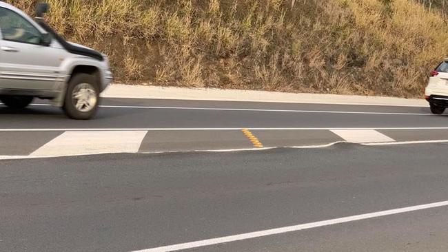 Apparent buckling or ”shoving” of the new highway pavement near the Robert Road intersection.