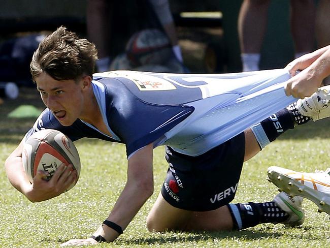 Wilson Ruthven from U14 Gen Blue tackled by Edward Bryant from U15 Ella. U15 Ella (Green) v U14 Gen Blue (Blue).  Rugby Union Next Gen Cup for Under 15s and U14s. Picture: John Appleyard