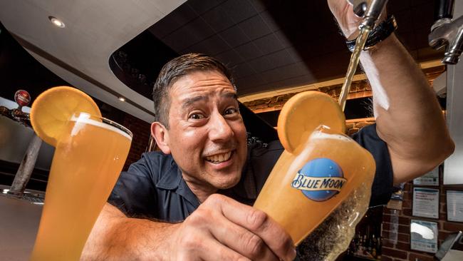 International beer expert Keith Villa pours a beer with a slice of orange ahead of the Great Australian Beer Spectapular. Picture: Jake Nowakowski.