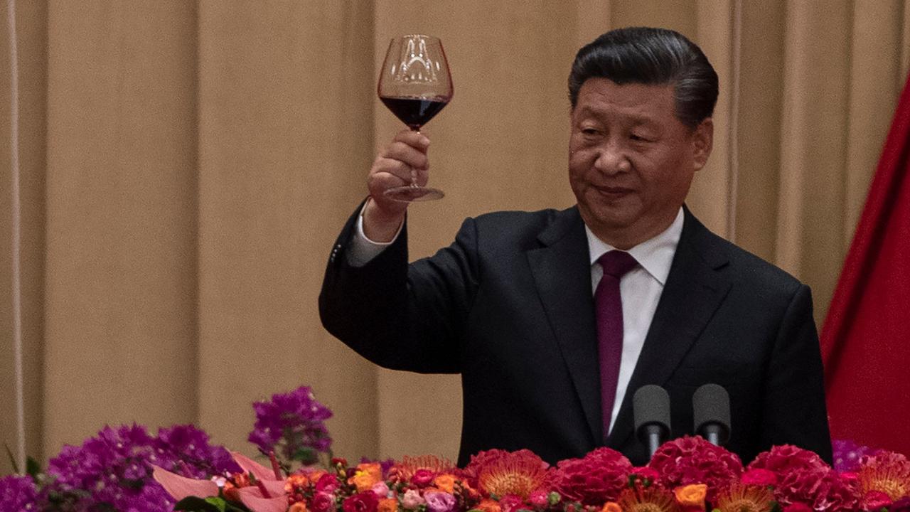 China's President Xi Jinping raises a toast to celebrate the 70th anniversary of the founding of the People's Republic of China. Picture: AFP