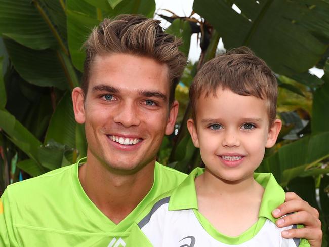 Sydney Thunder cricketers Chris Green with a young fan.