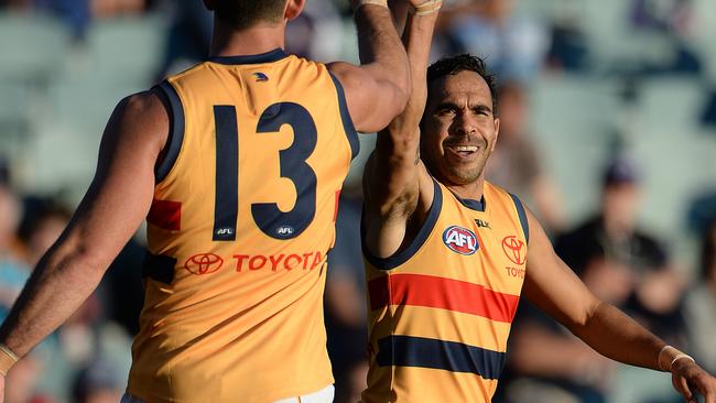 Adelaide's Eddie Betts celebrates a goal in the last term with Taylor Walker. Photo by Daniel Wilkins