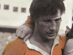 Rugby player John Hipwell is carried from the field by Reg Smith (left) and Stuart MacDougall in Australia versus England rugby match in 1975. a/ct