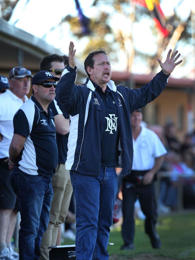 A frustrated Trevor Mitton coaching Noarlunga in 2015 during the preliminary final loss to Brighton, his last match in charge of the Shoes. Picture: Dean Martin