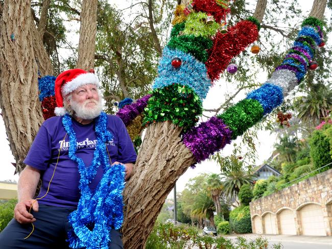 Mr Johnson decorated the tree outside Mosman Bay Wharf with tinsel and ornaments for Christmas 2012.