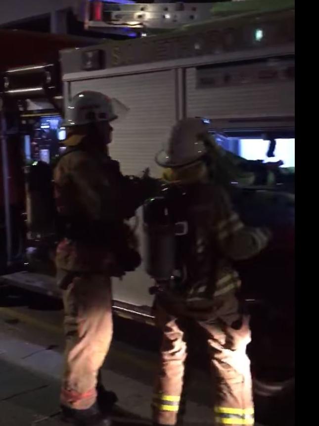 Firefighters outside the Crazy Horse Revue in Adelaide early this morning.