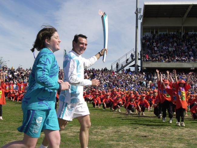 September 4, 2000: Athlete and marathon runner Pat Farmer runs into Campbelltown Sports Stadium during Penrith to Bowral leg of Sydney 2000 Olympic Torch Relay. Picture: Robert McKell