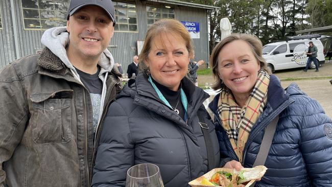 Heading to the food stands at the Winter Wine Fest were Tim Zoch, Hastings, Fiona Crowley, Gisborne and Deb Carr, Gippsland. Picture: Lucy Callander