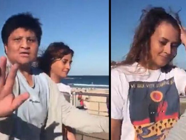 A bodyguard stands between Lucia Rodriguez and a protester in Bondi. Picture: YouTube