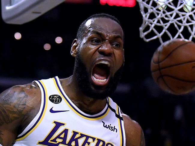 LOS ANGELES, CALIFORNIA - MARCH 08:  LeBron James #23 of the Los Angeles Lakers celebrate his basket and LA Clippers foul during a 112-103 Lakers win at Staples Center on March 08, 2020 in Los Angeles, California.   NOTE TO USER: User expressly acknowledges and agrees that, by downloading and or using this photograph, User is consenting to the terms and conditions of the Getty Images License Agreement.  (Photo by Harry How/Getty Images) *** BESTPIX ***