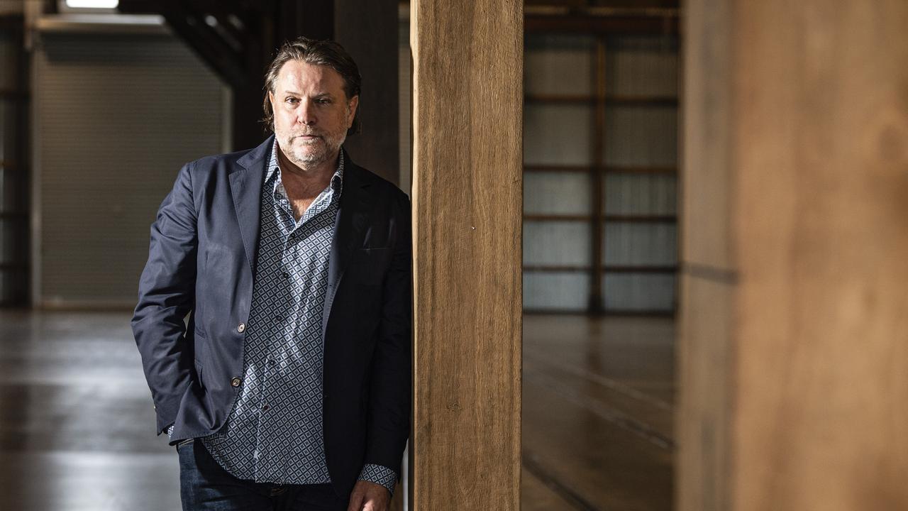 Music promoter and Powderfinger bassist John Collins inside The Goods Shed during a tour of the city's potential live music venues. Picture: Kevin Farmer