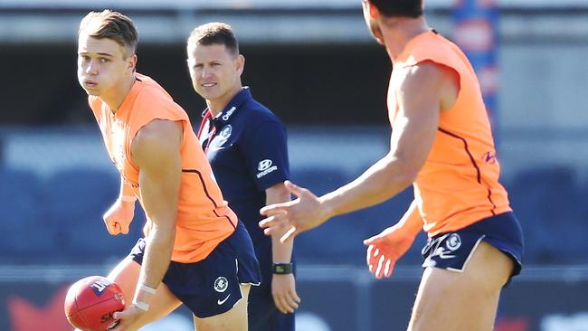 Carlton star Patrick Cripps trains under the watchful eye of coach Brendon Bolton on Monday.