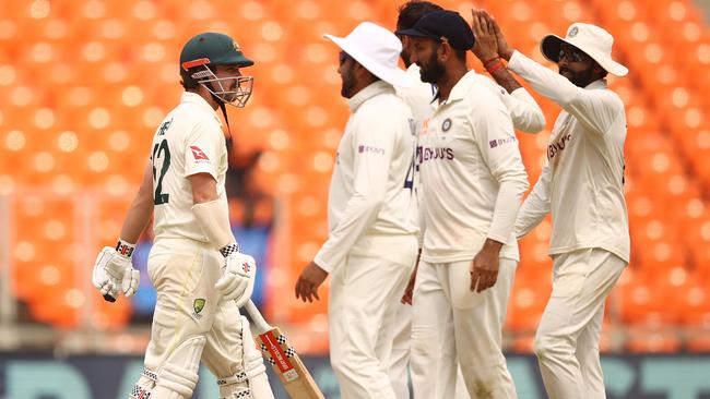 India celebrate the dismissal of Travis Head, one of only two wickets to fall