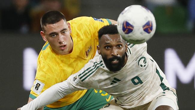 NCA. MELBOURNE, AUSTRALIA. 14th November 2024.  Australian Socceroos vs Suadi Arabia at Melbourne Rectangular Stadium .   Saudi Arabias Feras Albrikan  and Lewis Miller of the Socceroos  battle for position 1st half  .  Picture: Michael Klein