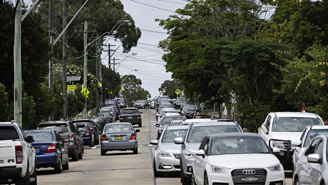 Cars line up for COVID testing at the Inner West Council Works Depot. Picture: Adam Yip