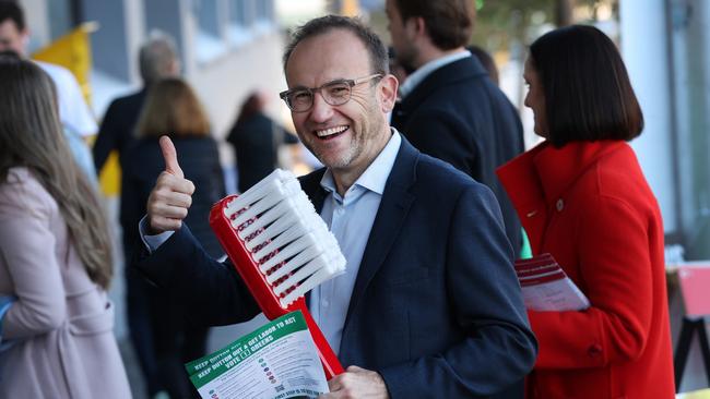 Greens leader Adam Bandt holds a giant toothbrush to promote adding dental to Medicare during the campaign. Picture: David Caird / NewsWire