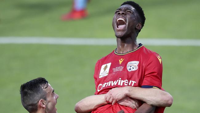 Adelaide United forward Al Hassan Toure celebrates his stunning opener in the Reds’ FFA Cup final triumph. Picture: Sarah Reed