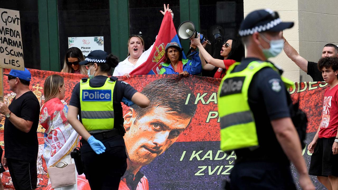 Fans showed their support for Djokovic outside the Melbourne hotel he’s being kept in. (Photo by William WEST / AFP)