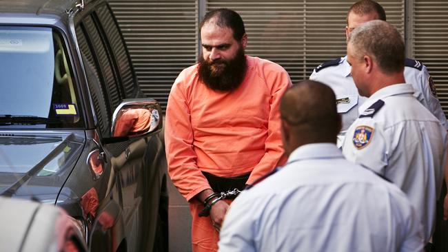 Belal Saadallah Khazaal arrives in handcuffs at the NSW Supreme Court at King Street, Sydney for his sentencing hearing for his producing of a book knowing it could assist a terrorist act.