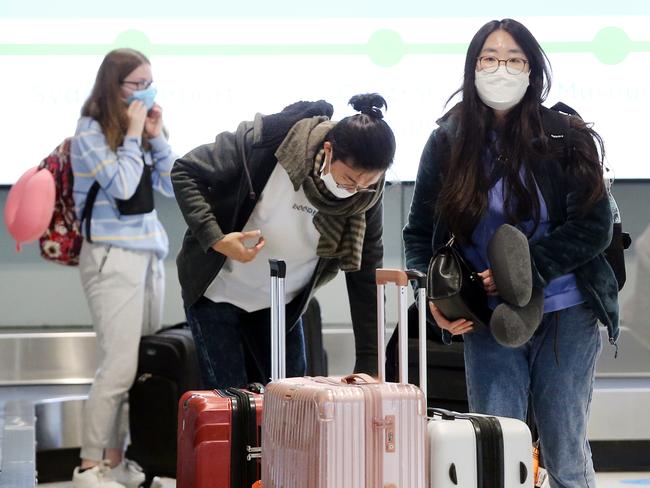 Pictured are passengers arriving from Melbourne at the Qantas terminal at Sydney Domestic Airport .The NSW/Victoria border will close tonight following a new outbreak of Covid19 in Greater Melbourne.Picture: Richard Dobson