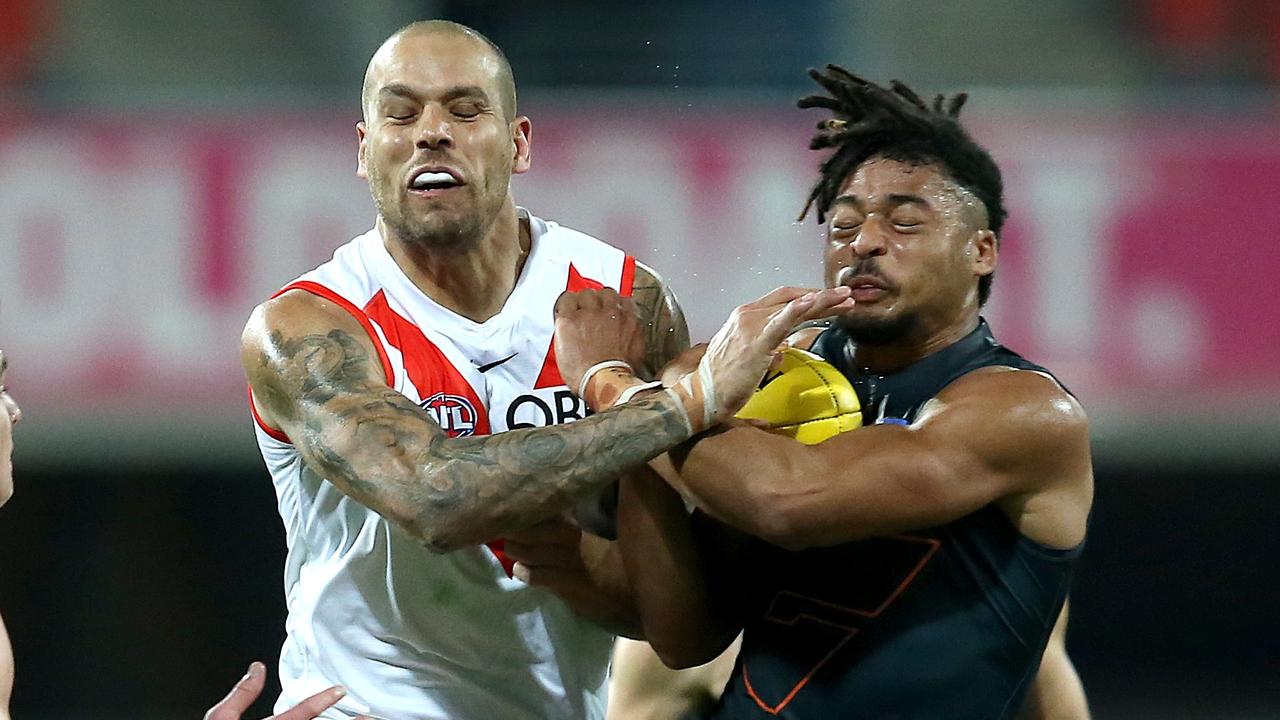 Giant Connor Idun (right) collides heavily with Swans superstar Lance Franklin in one of last year’s Sydney derbies. Picture: Getty Images