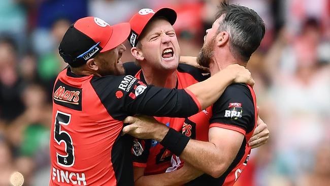 MELBOURNE, AUSTRALIA - FEBRUARY 17: Aaron Finch, Cameron White and Dan Christian of the Melbourne Renegades celebrate winning the Big Bash League Final match between the Melbourne Renegades and the Melbourne Stars at Marvel Stadium on February 17, 2019 in Melbourne, Australia. (Photo by Quinn Rooney/Getty Images)