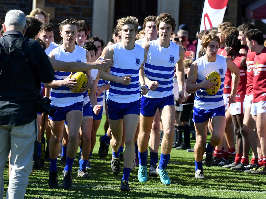 St Peter’s players head out for the start of the game against Prince Alfred. Picture: AAP/ Keryn Stevens.