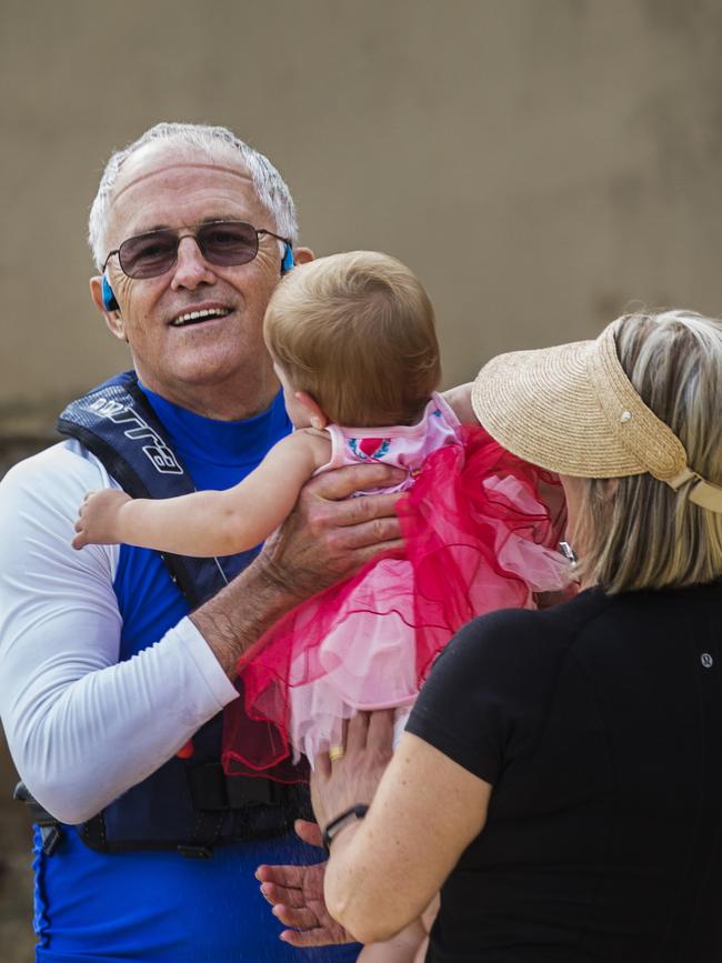 Mrs Turnbull hands the PM’s granddaughter over for a hug. Picture: Jenny Evans