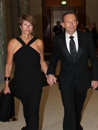 Job ID PD301884. The Prime Minister Tony Abbott with his wife Margie, wearing a Simona black evening dress, arrive for the Mid Winter Ball. Pic by Gary Ramage