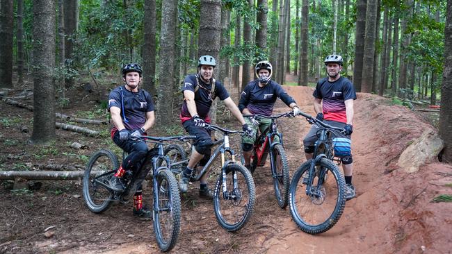 Jason Laska, Tony Trafford, Grant Doherty and Gus Soper in front of the Smithfield Mountain Bike Park. Picture: Nuno Avendano