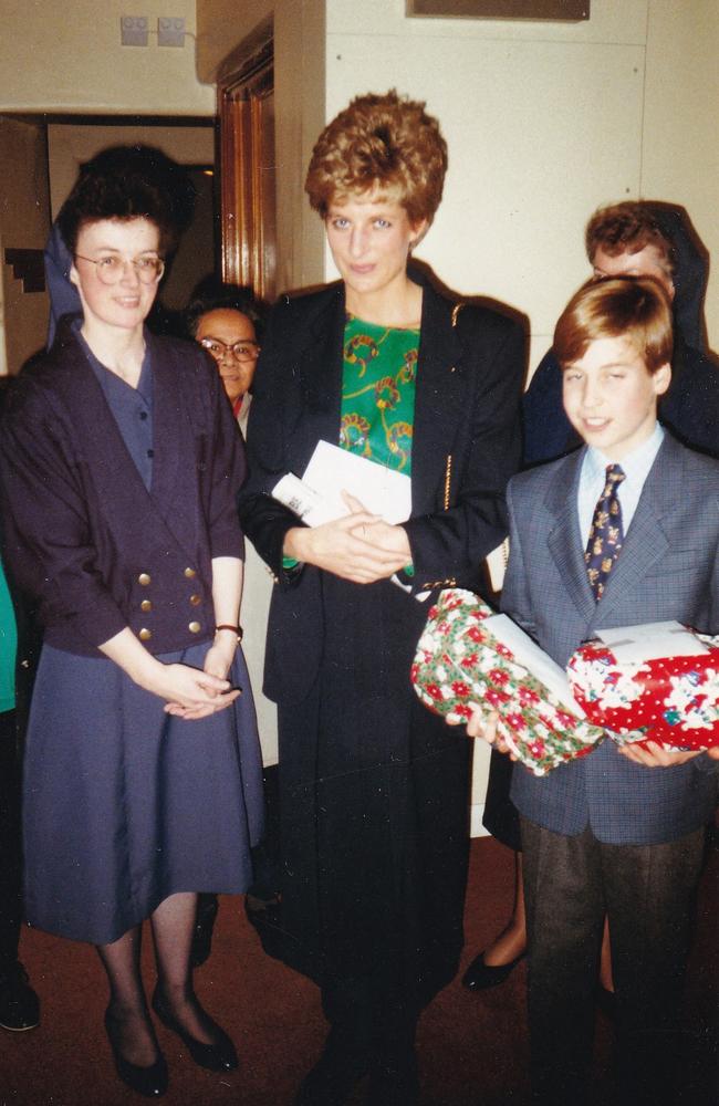 Princess Diana (C) with her 11-year-old son William (R), now Prince William, Prince of Wales during one of his first visits to homelessness charity, The Passage in London, taken on December 14, 1993. Picture: AFP